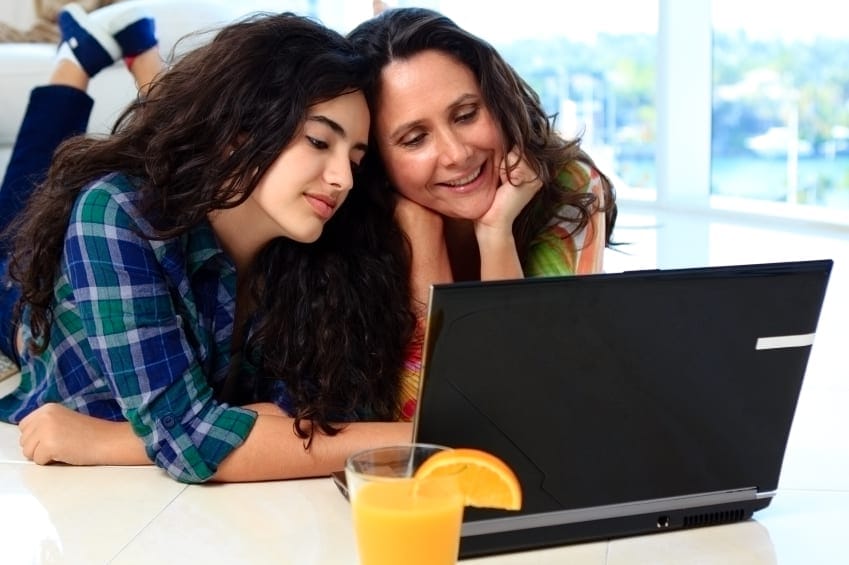 Mother and daughter looking at computer