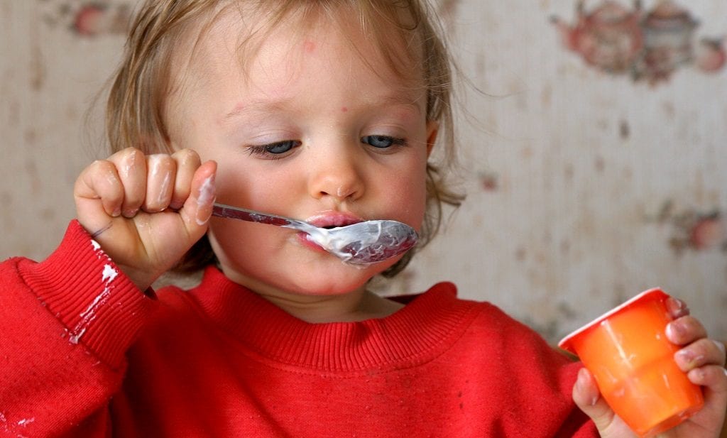 Child eating yoghurt messily stop worrying