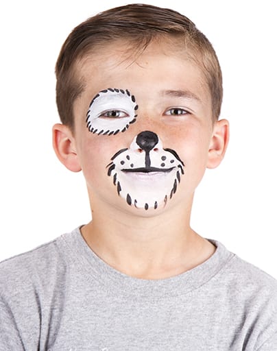 Young boy wearing dog carnival face paint isolated on white