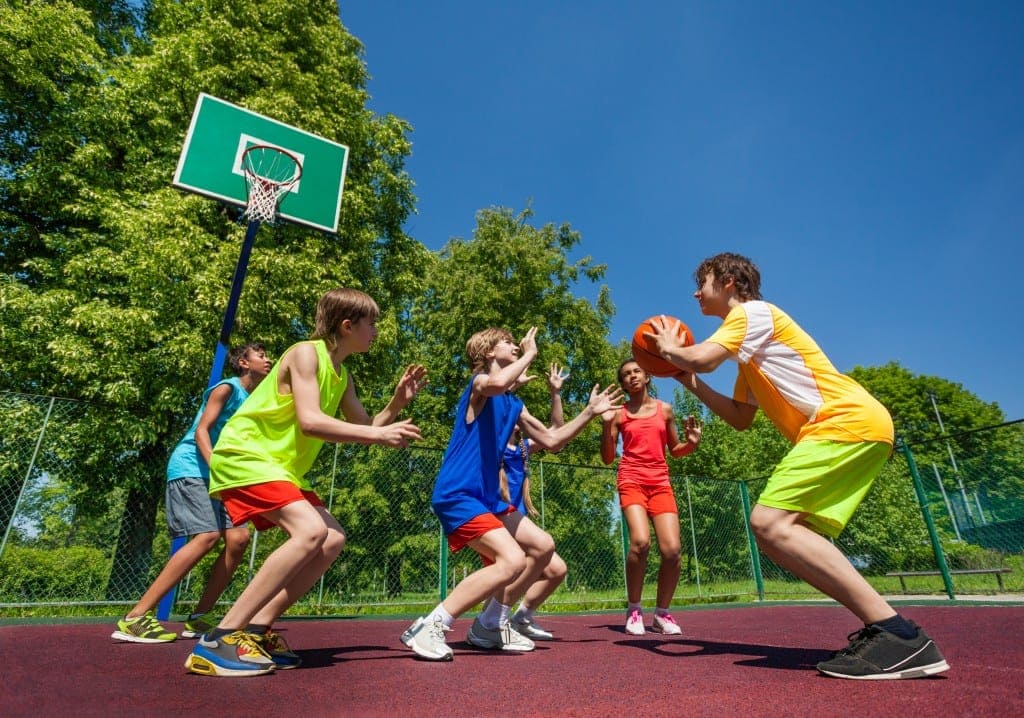 Basketball for kids - kids playing baketball on a bright day