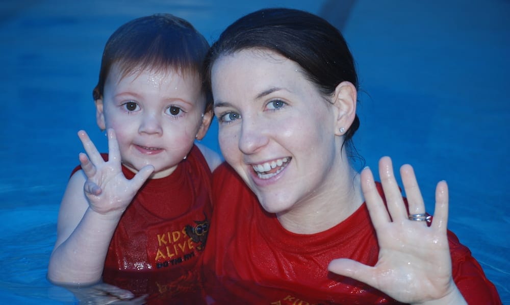 Emma Lawrence and child in pool