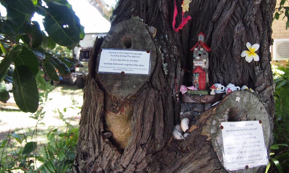 Miniature fairy fire station hidden in a tree