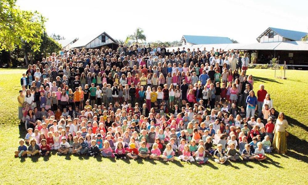 Shearwater Steiner School all students and teachers in a group photo on school oval