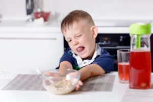 young boy wont eat breakfast