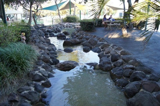 Settlement Cove seating and artificial rocky stream