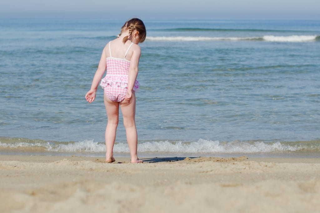 Jellyfish sting girl on beach