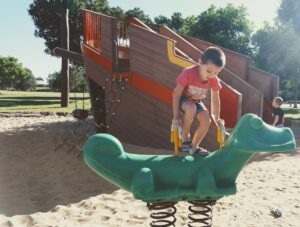 palm beach parklands dune cafe child playing on playground equipment at palm beach parklands