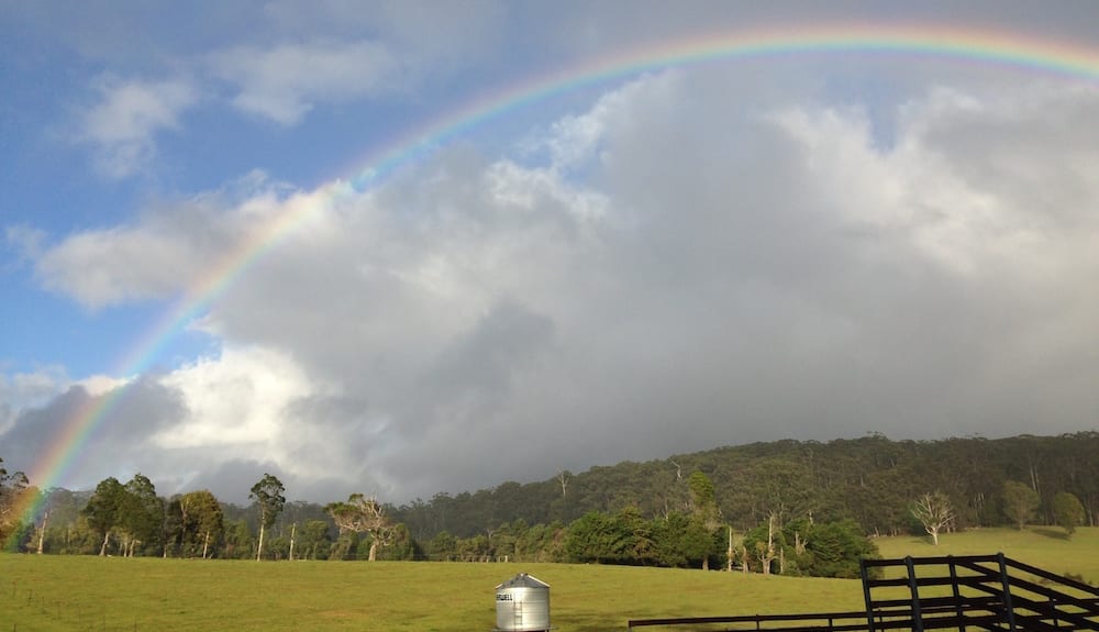 rainbow over field Farm stay gold coast