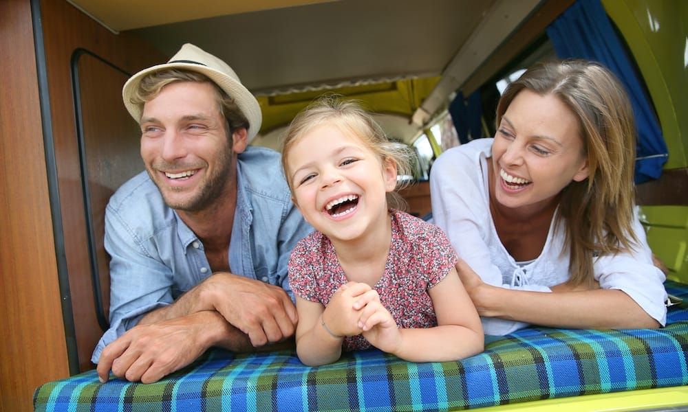 Portrait of cheerful family having fun in camper Family Friendly Camping Murwillumbah