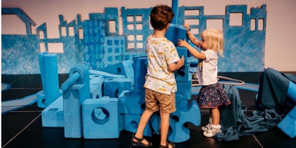 Toddlers playing with building blocks at The State Library of Queensland
