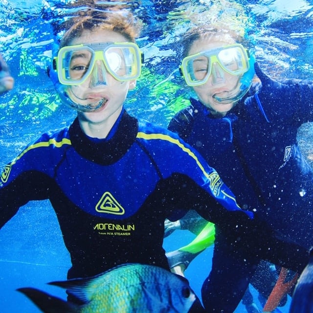 The kids snorkling on the Great Barrier Reef