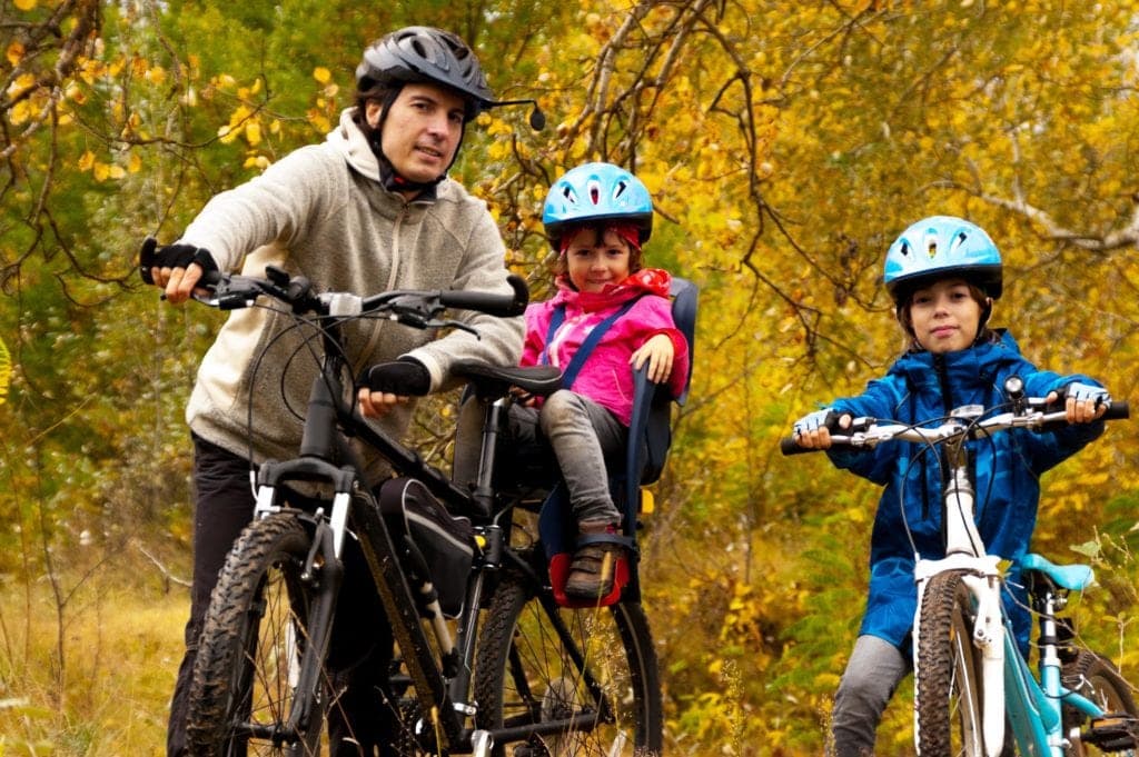 Family Cycling with Small Child in Bike Seat