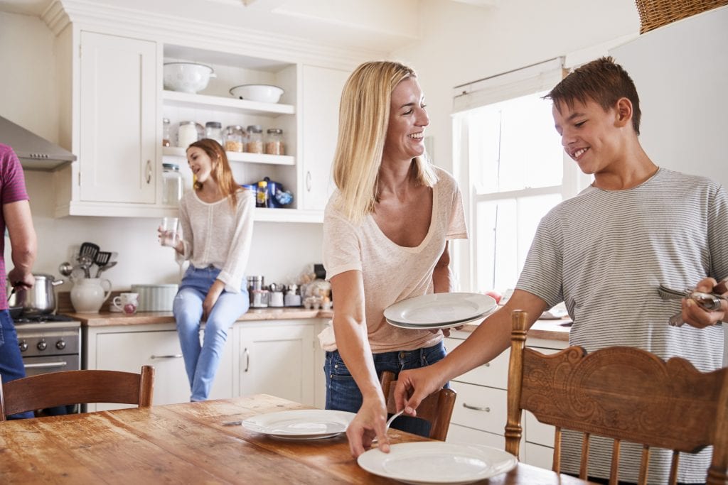 Family laying Table Together and Chatting