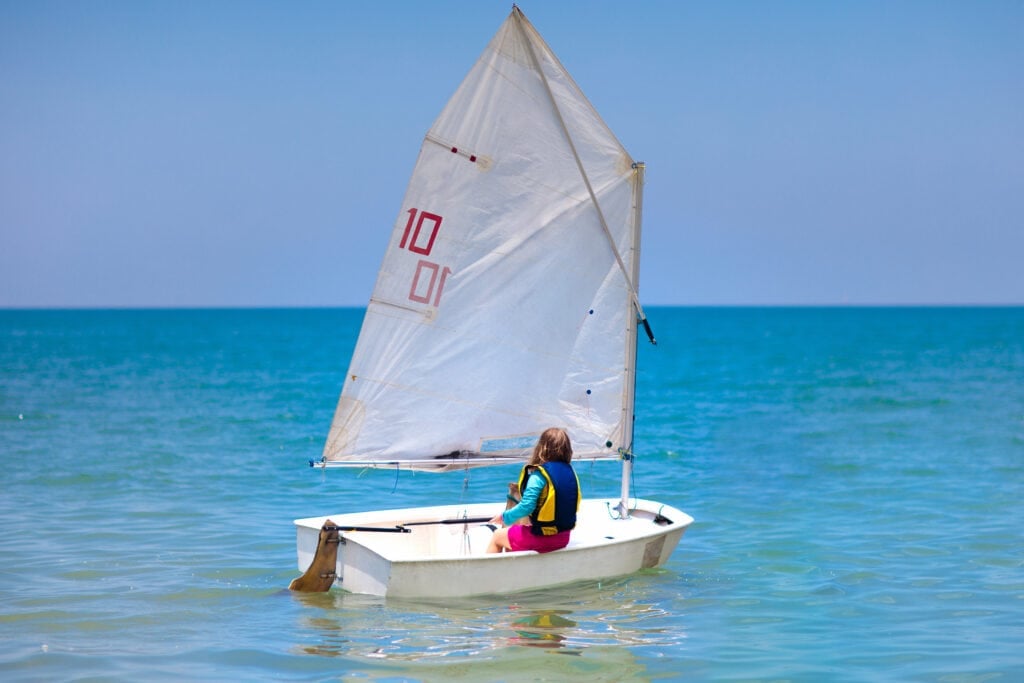 Child learning to sail individually