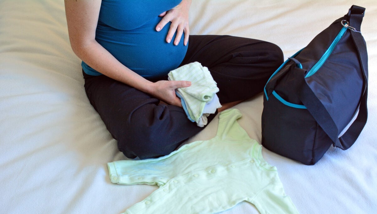 Pregnant woman packing hospital bag