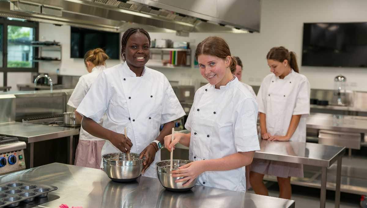 Some girls at St John Fisher College in the catering kitchen