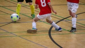 children playing indoor soccer