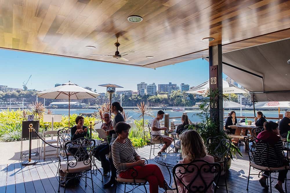 Image of Medley Cafe at Kangaroo Point, with a view of the Brisbane River in the background. 