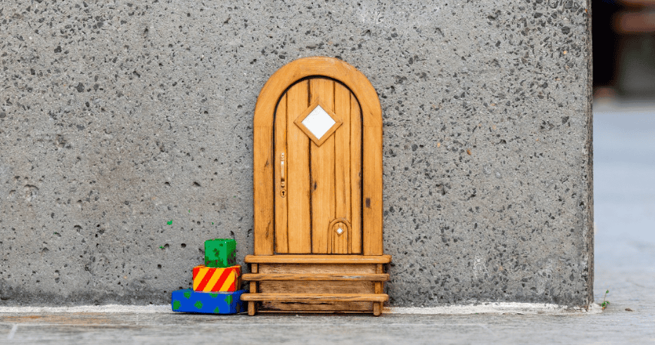 Tiny Christmas door against a wall
