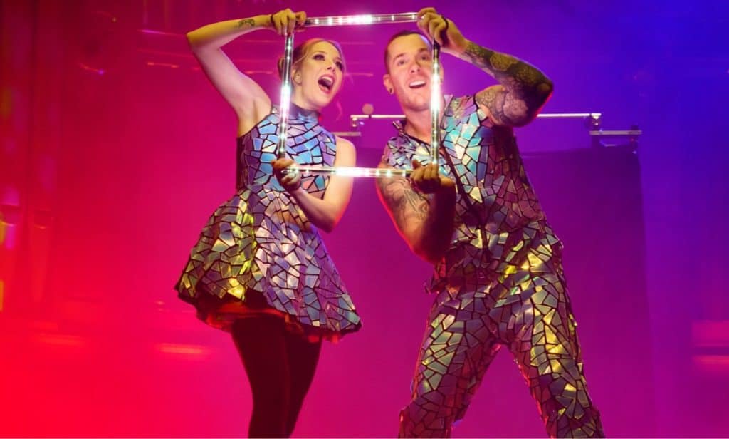 Two performers perform a dazzling trick