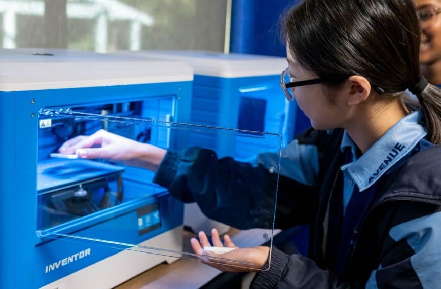 Student using a 3D printer in the STEAM hub at Grand Avenue State School