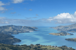 Family travel adventure across New Zealand — scenic landscapes, mountains, and coastal views from the North and South Island