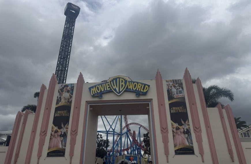 Entrance to Warner Bros. Movie World on the Gold Coast with roller coasters visible inside the park
