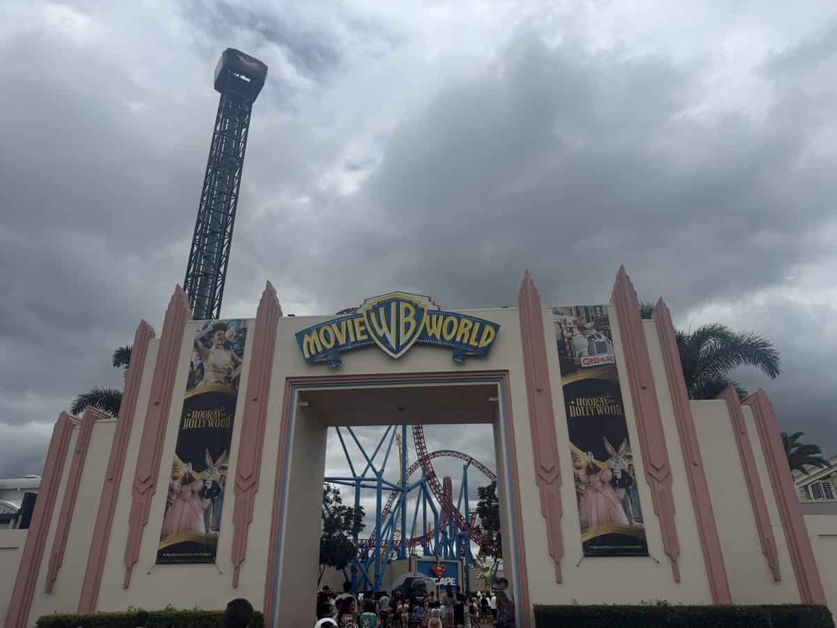 Entrance to Warner Bros. Movie World on the Gold Coast with roller coasters visible inside the park