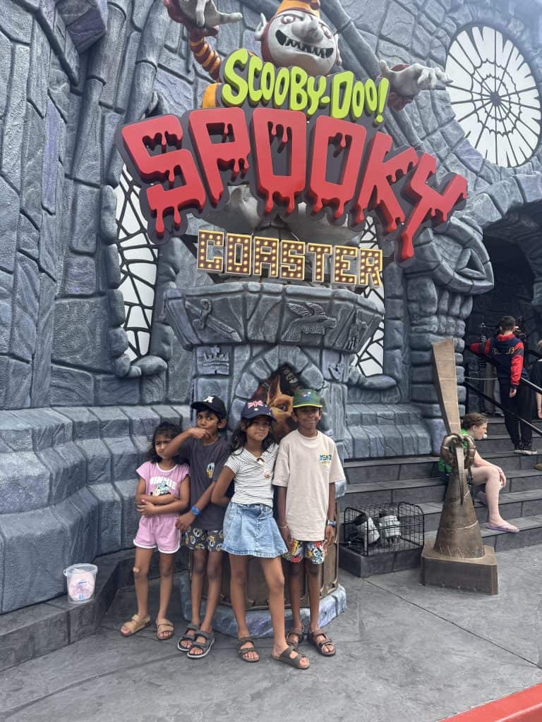 Children standing outside the Scooby-Doo Spooky Coaster ride at Warner Bros. Movie World on the Gold Coast