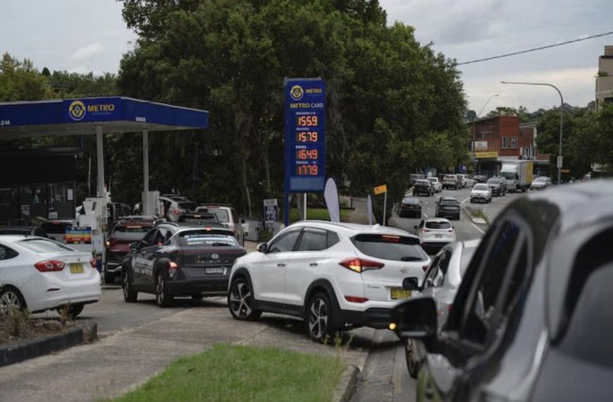 Cars lining up at a petrol station as fuel prices rise in Australia.