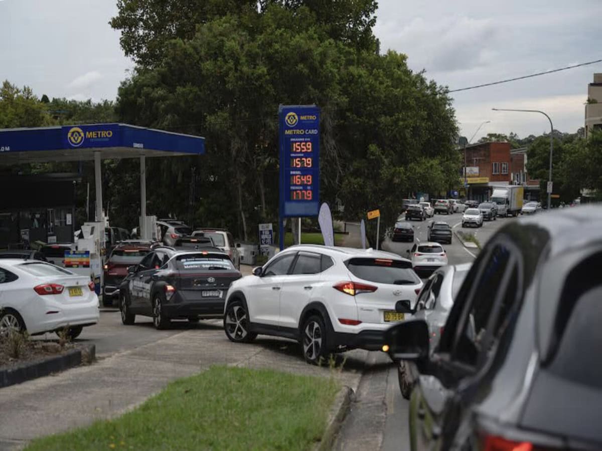 Cars lining up at a petrol station as fuel prices rise in Australia.