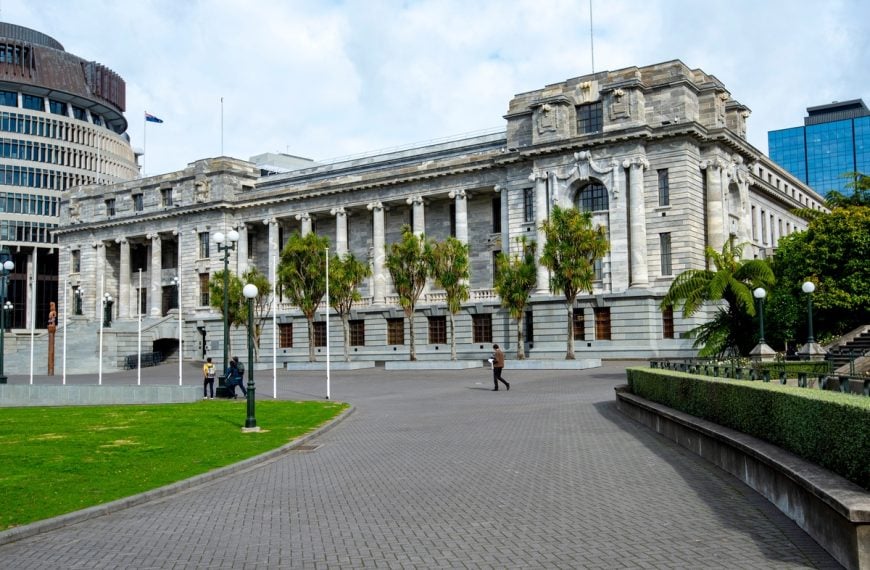 New Zealand Parliament building in Wellington during debate over public sector jobs, AI automation and government spending reforms.