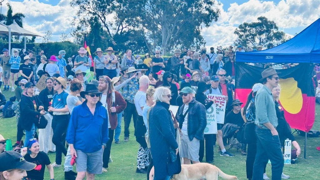 People gathered at Victoria Park during a community protest relating to proposed development plans.